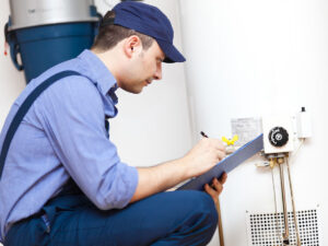 %Focuskw% | Divine Image of a plumber working on a hot water heater