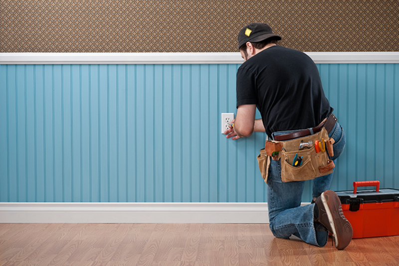 Electrician Working on Outlet