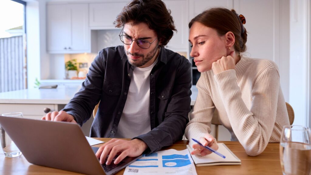 Two people reviewing their water bill