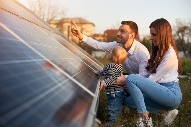 Family looking at their solar panels.