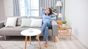%Imagetitle% | Divine Woman happily relaxing on a couch