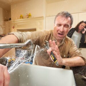 %Title% | Divine A man struggling with his kitchen sink