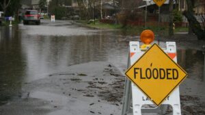 flooded street with flooded sign